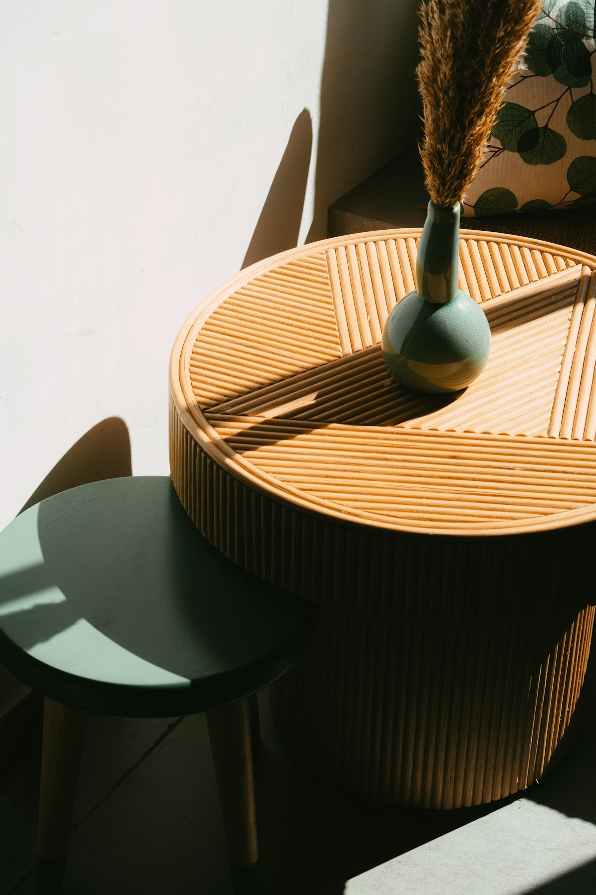 A stylish interior scene with a vase and tables.