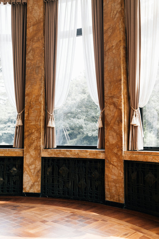 Elegant room with marble pillars and sheer curtains