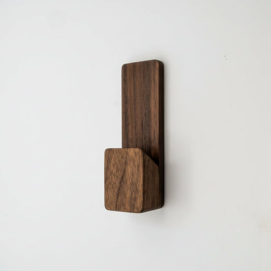Wooden wall hook on a white background