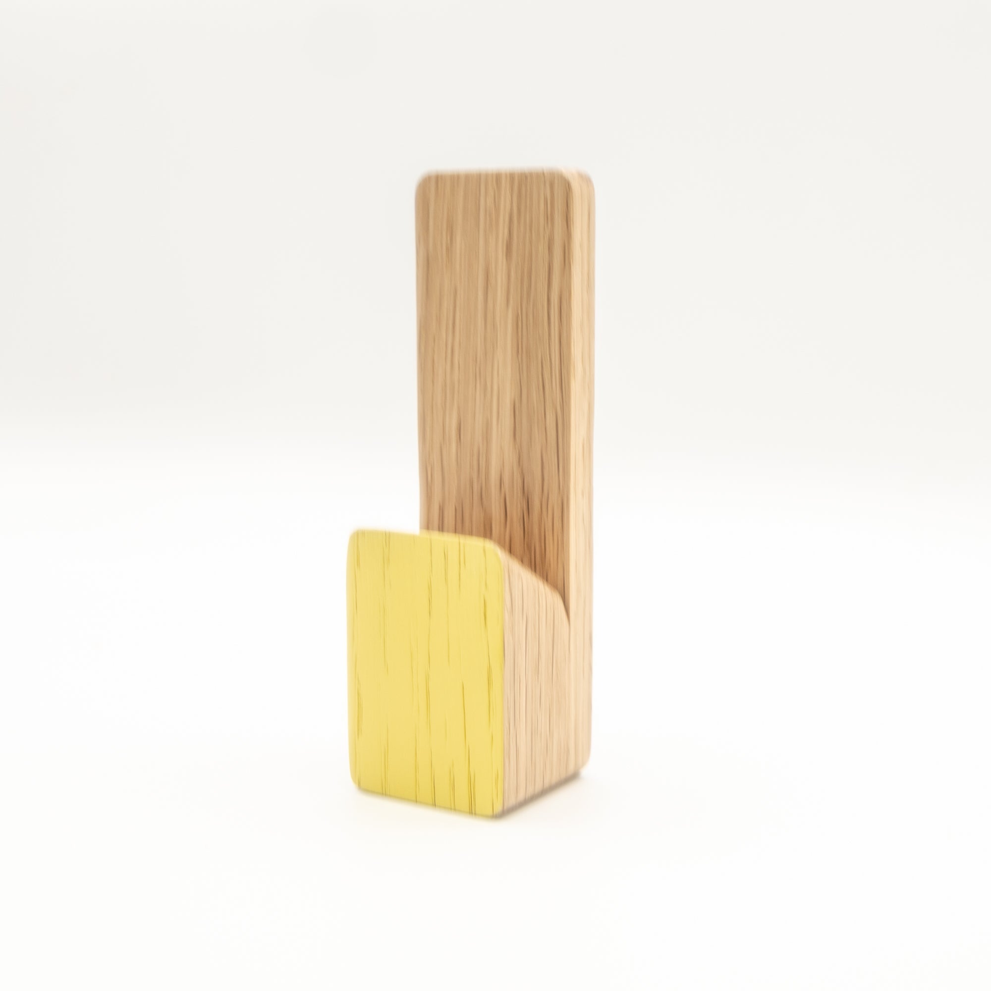 Wooden and yellow phone stand on a white background